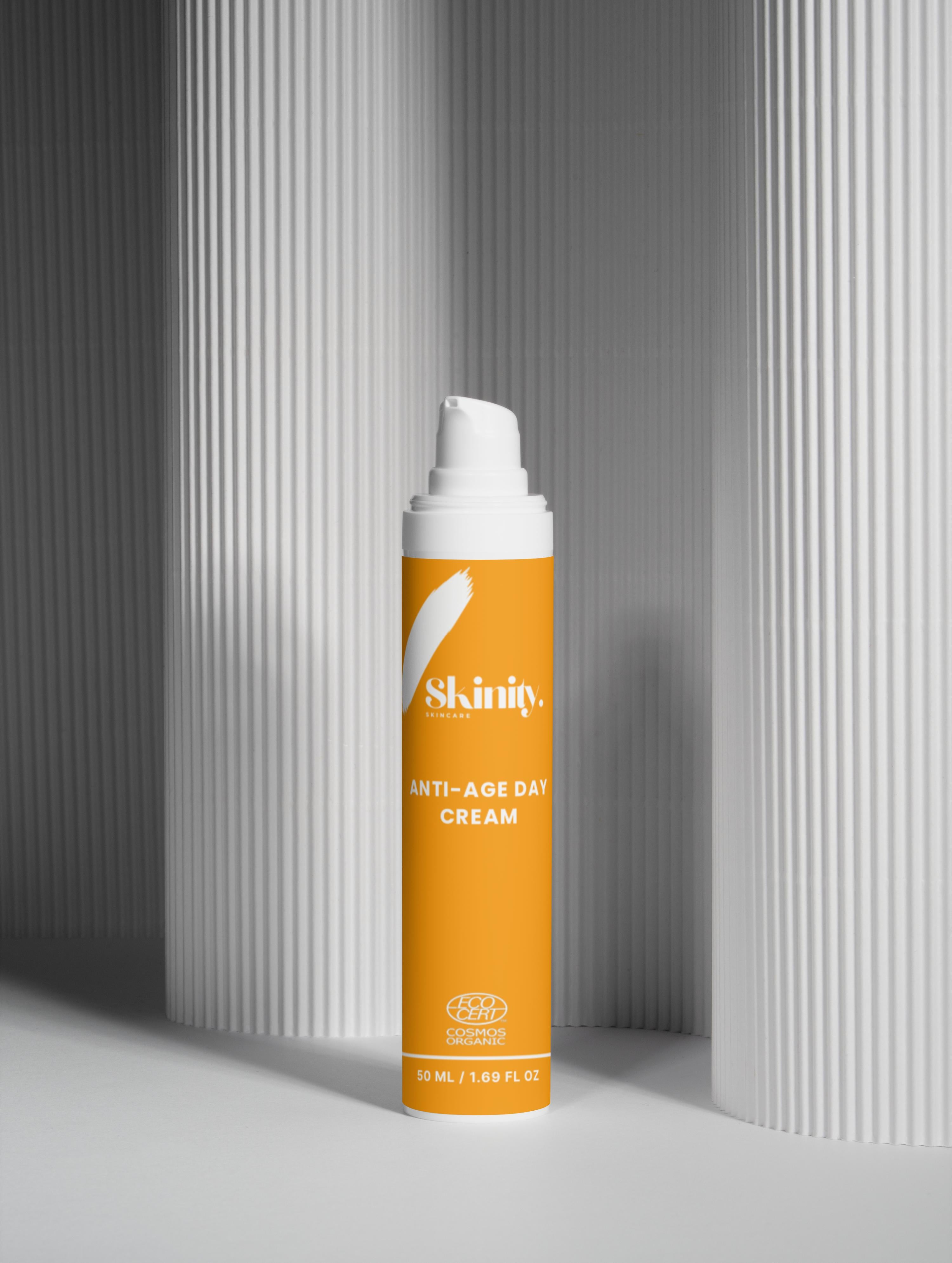 Anti-Age Day Cream For All Skin in sleek packaging on a minimalistic backdrop.