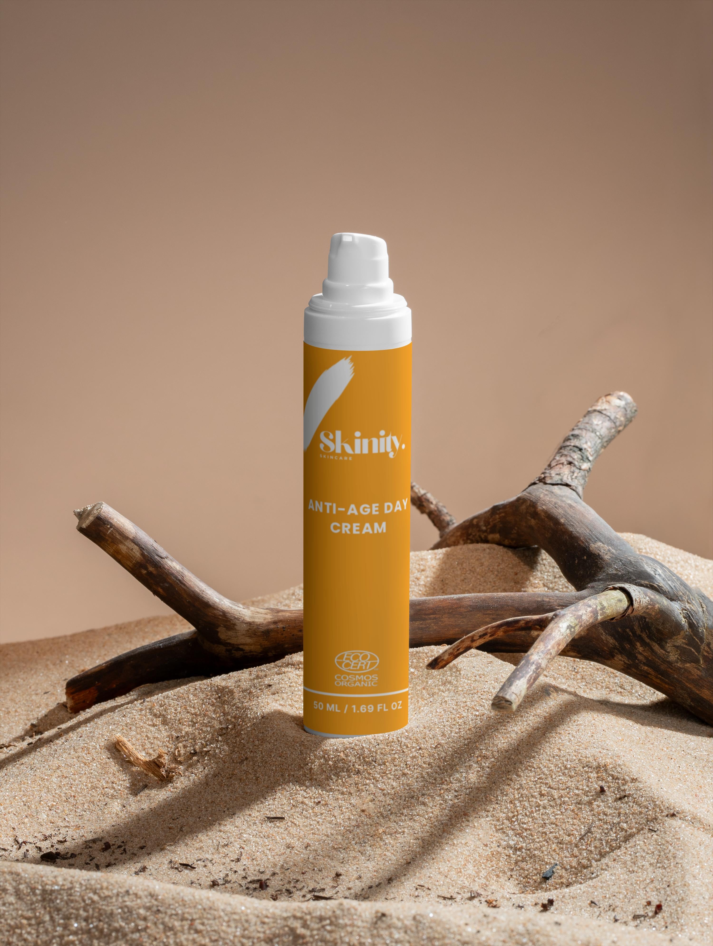 Skinity Anti-Age Day Cream For All Skin on sandy background with driftwood.