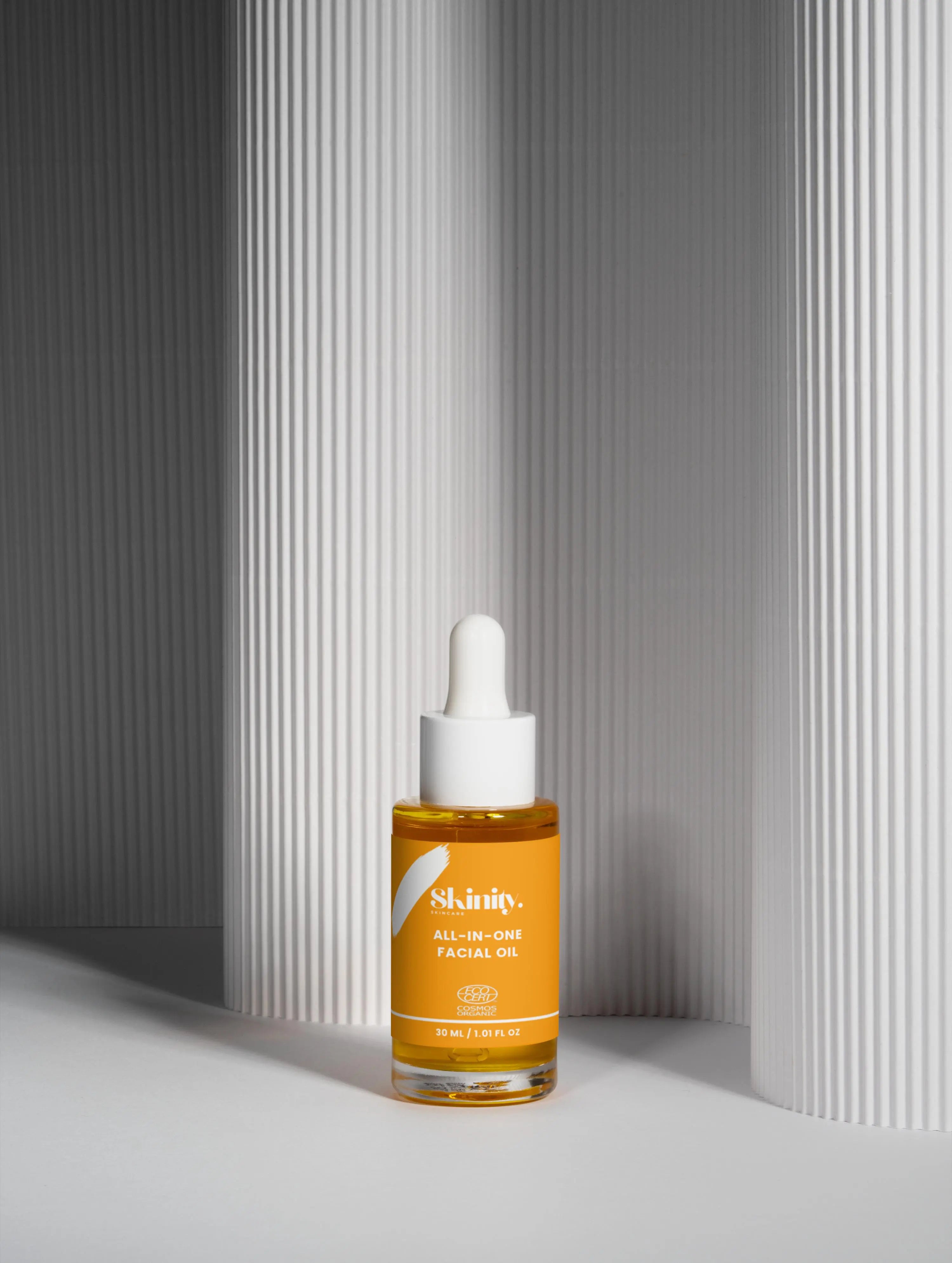 All-In-One Facial Oil for all skin in a dropper bottle, enhancing hydration and radiance for all skin types.