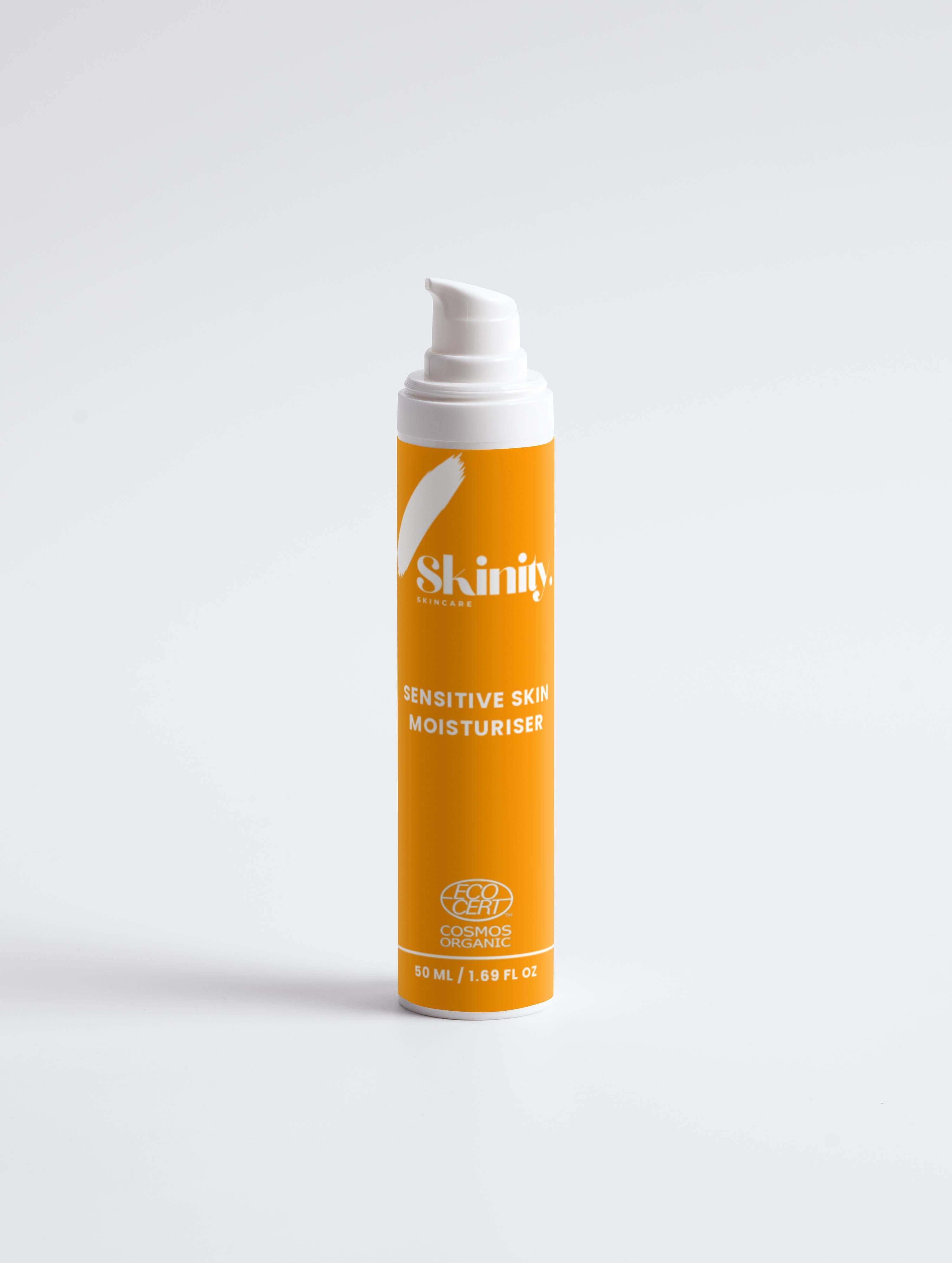 Sensitive Skin Moisturiser Fragrance Free in a bright orange pump bottle for delicate skin care.