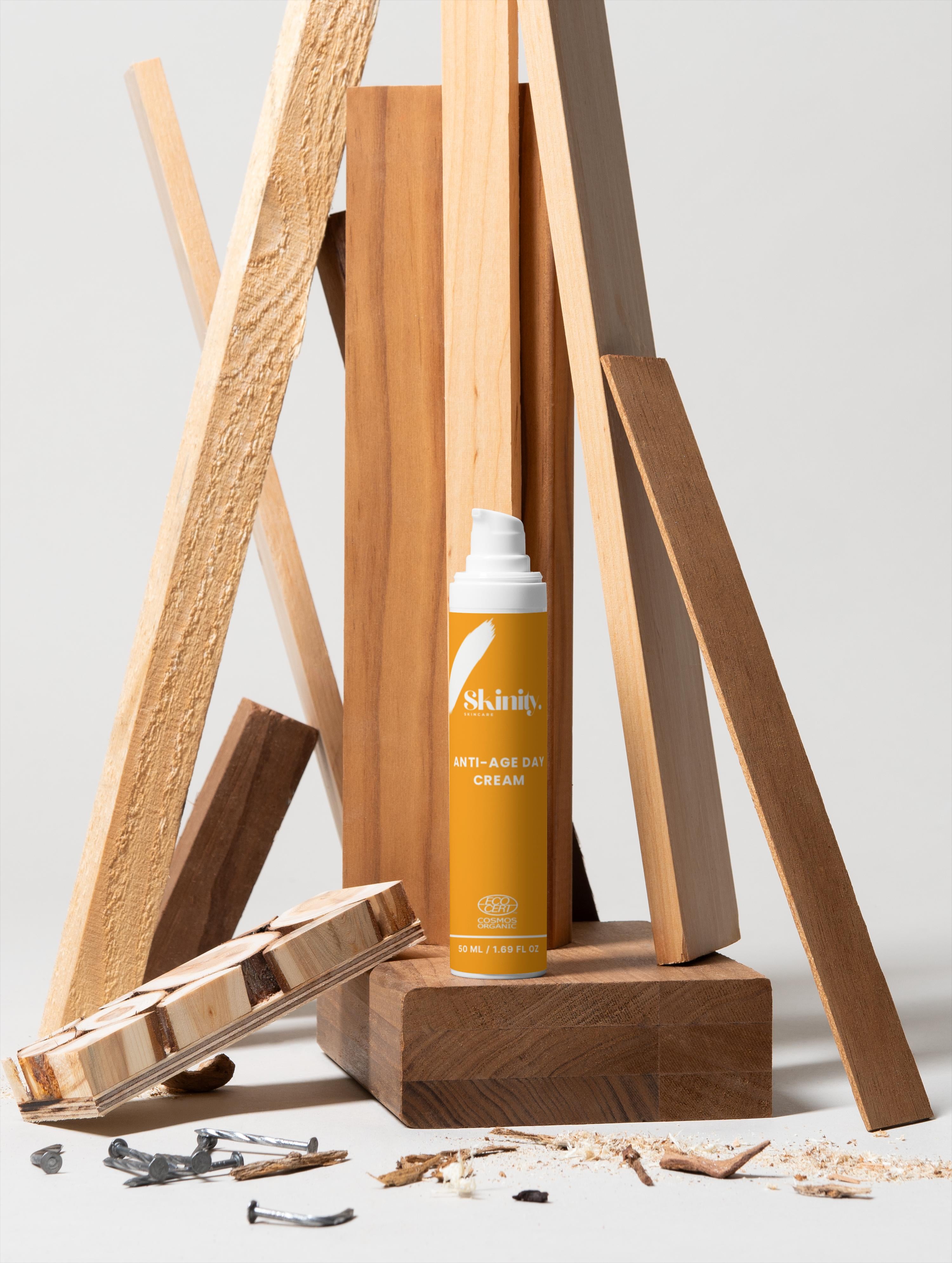 Anti-Age Day Cream For All Skin displayed on wooden blocks and background with tools.