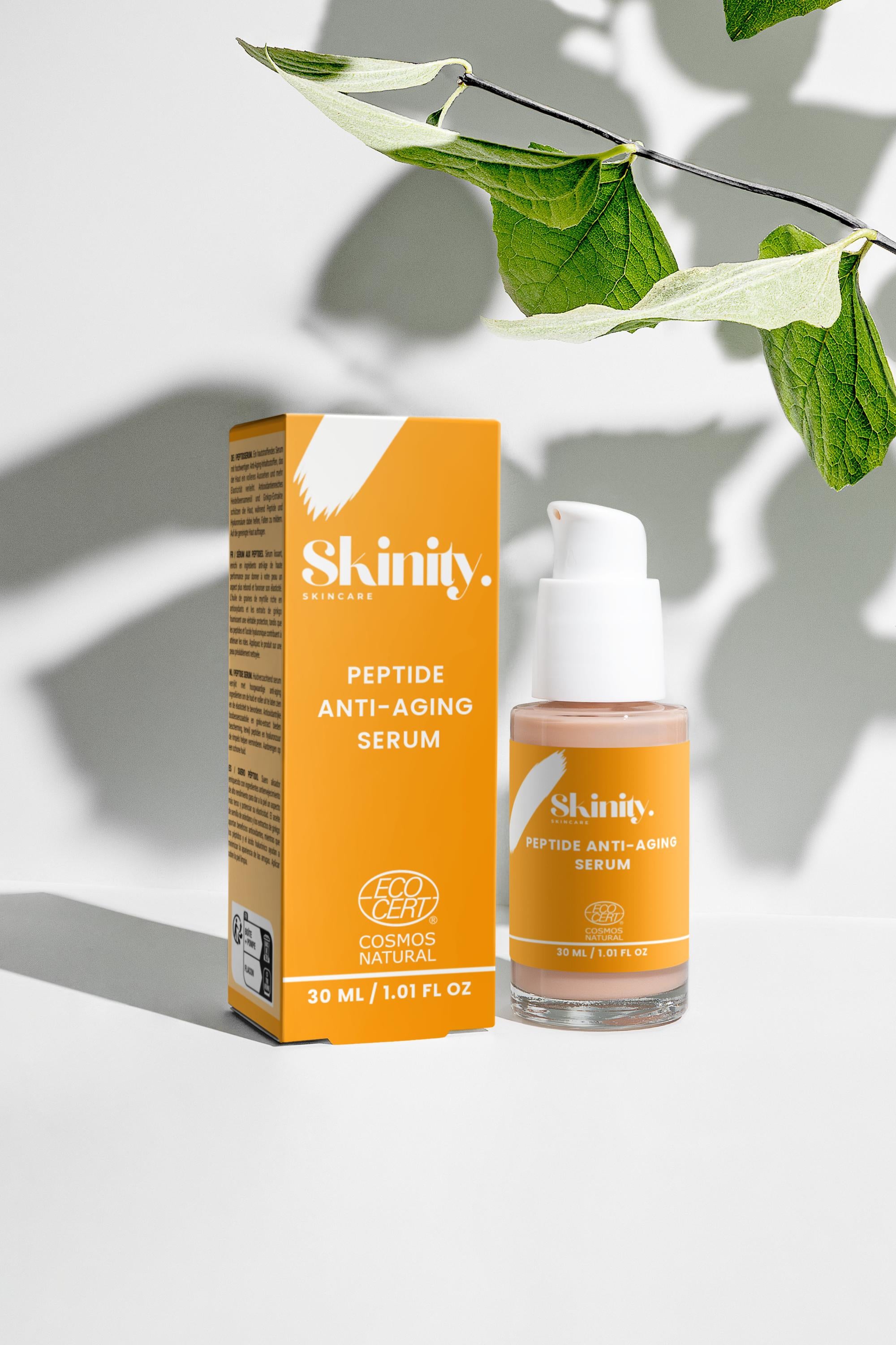 Peptide Anti-Aging Serum for All skin in a stylish bottle with orange packaging and greenery in the background.