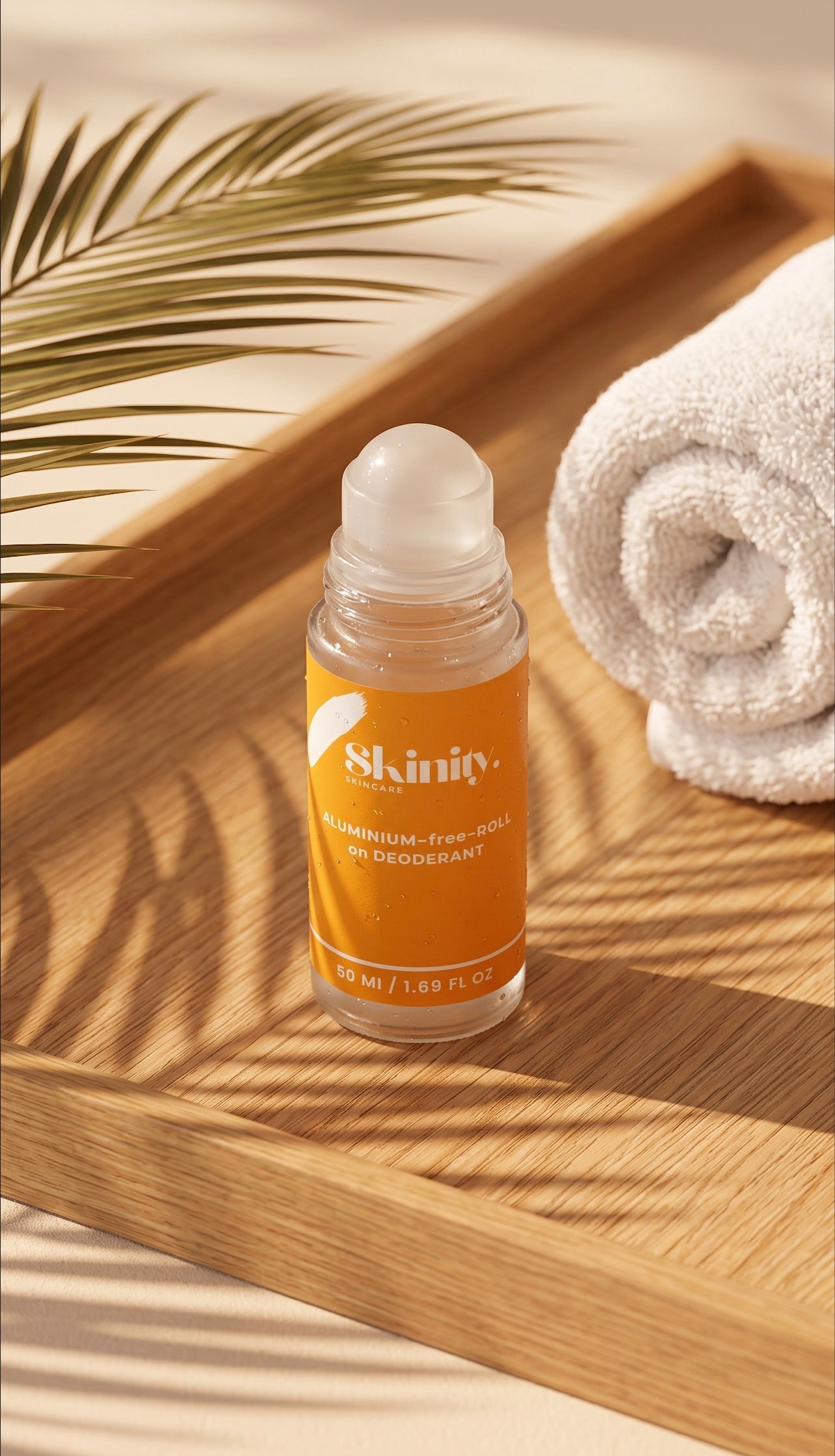 Skinity natural aluminum-free roll-on deodorant 50ml bottle with orange label and white cap